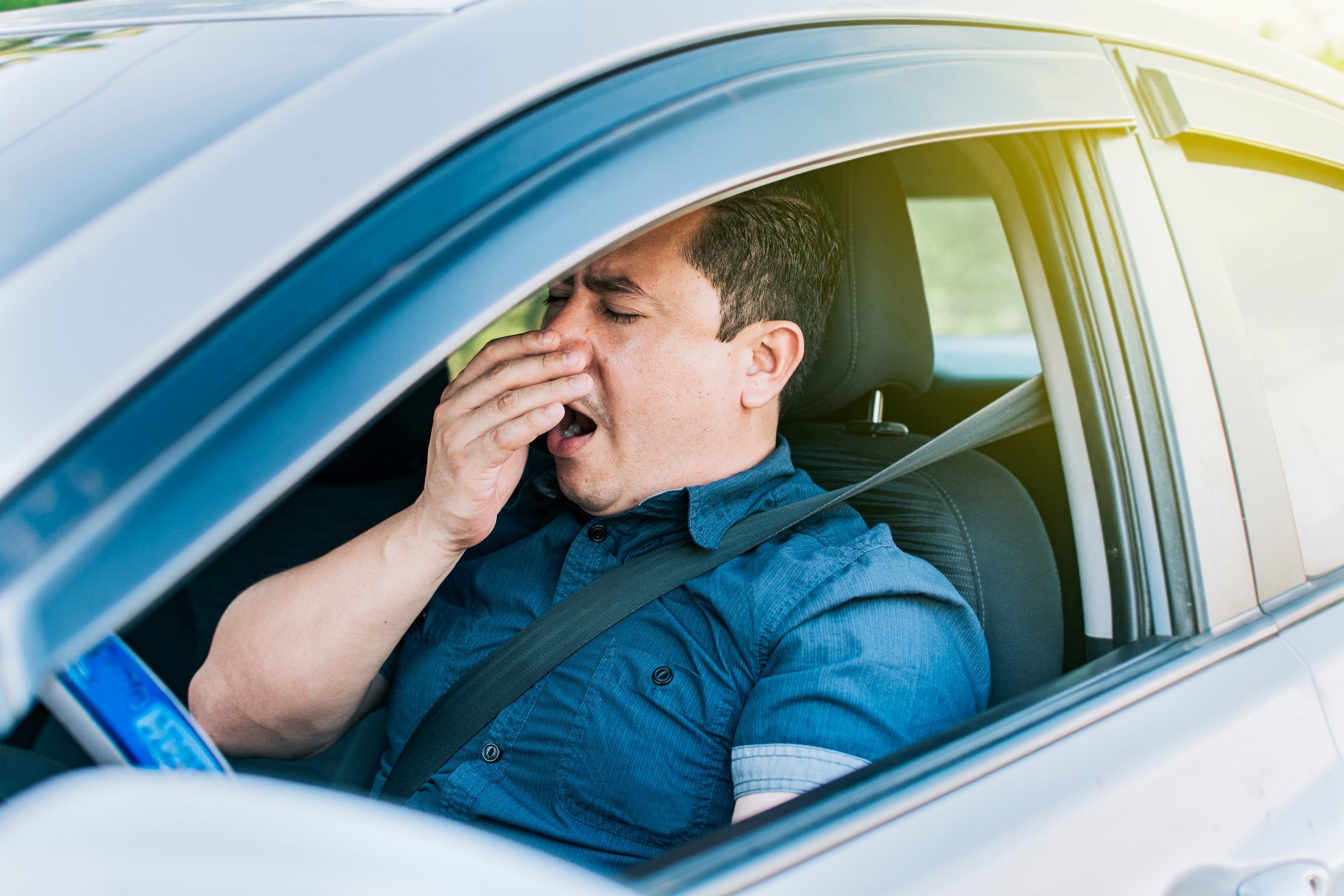 A Sleepy Driver at the Wheel, a Tired Person While Driving, Tire